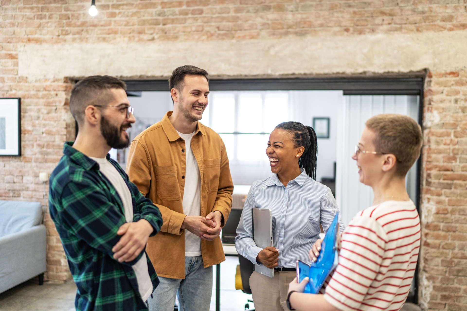 Young diverse colleagues having a casual business discussion